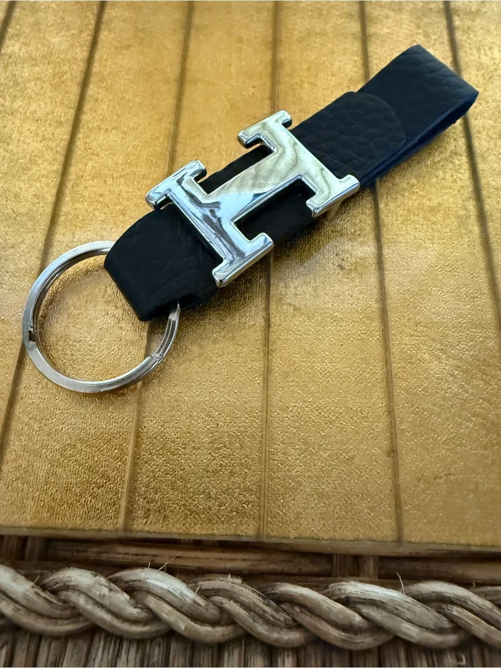 “H” chrome and black leather keychain